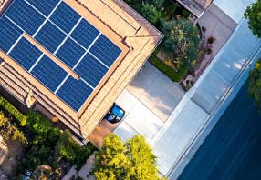 Aerial view of a house with solar panels